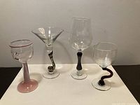 All four art glass glasses side by side