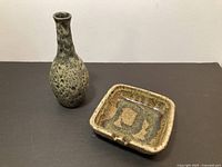 Lorenzen bottle vase and Levine ashtray side by side
