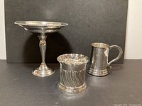 Front view of all three silver pieces