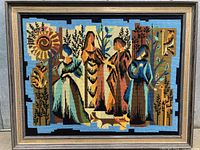 Full view of framed needlepoint tapestry showing entire design