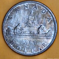 Voyageur reverse side of 1963 Canadian silver dollar