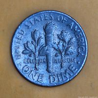 Reverse of 1965 Roosevelt dime showing torch design and legends