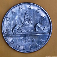 Reverse side showing Voyageur canoe design and 1969 date