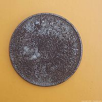 Obverse showing Chinese script surrounding centre