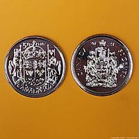 Two 50-cent coins showing Coat of Arms reverse designs