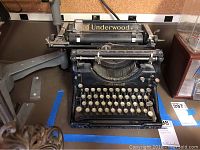 Front view showing full keyboard with round keys and 'Underwood' branding on platen and front body.