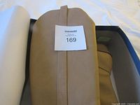 Boot inside box showing color and MaxSold tag 169