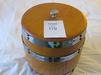 Top view showing lid with silver-tone knob and overall shape