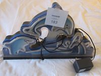 Neon dolphin light unlit with attached power cord and adapter