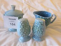 Full set showing all four blue ceramic pieces