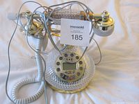 Full view of crystal telephone with cords and handset