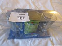Front view of sealed Champagne Gifts Irish Cream Coffee set showing tin, two glasses and swizzle sticks
