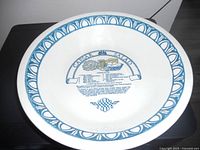 Top view showing blue rim design and printed Caesar Salad recipe