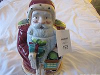 Front view of Santa cookie jar with lid on