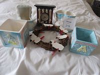 All items overview—four ceramic planters, Tickler desk clock, sheep wreath