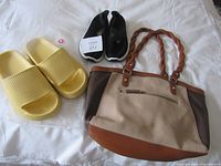 Yellow sandals, black sneakers, two-tone handbag overview