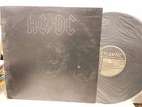 Front of AC/DC Back in Black sleeve with vinyl partially exposed showing Atlantic label