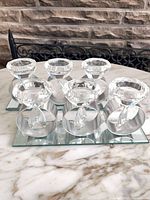 Front angled view showing both mirrored trays with crystal tealight holders
