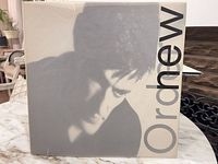 Front cover with portrait graphic and partial band name