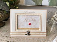 Front view showing frame design, inscriptions, dove accent and photo opening