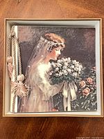 Album in presentation box showing illustrated bride cover and tassel binding