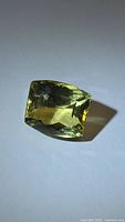 Front angled view of rectangular cushion lemon citrine showing color and facets