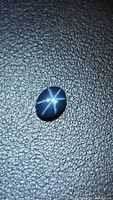 Oval cabochon sapphire showing six-ray star