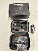 Box, camera in case, USB cable