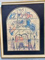 Full view of framed Marc Chagall lithograph with black mat and gold frame