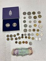 Full lot showing boxed set, loose coins, banknote