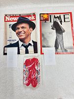 Front view of both magazines and sealed sticker transfer pack