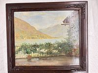 Front view of framed landscape painting