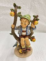 Front view of Goebel M.I. Hummel Apple Tree Boy figurine