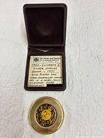 Paperweight in open presentation case with descriptive insert