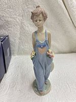 Front view of Lladró Pocket Full of Wishes figurine