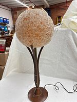 Full view of walnut and brass table lamp with spun lucite shade