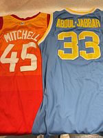 Front view of both jerseys side by side