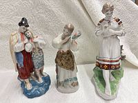 All three Soviet-era porcelain figurines front view