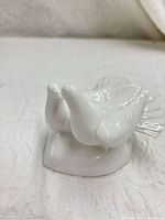 Front view showing pair of white porcelain doves