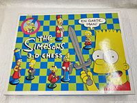 Front of box showing The Simpsons 3-D Chess artwork