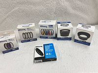 Overview of seven boxed Ultimaxx 55 mm accessories and 64 GB SDXC card