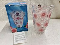 Vase, box and leaflet displayed on tabletop