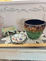 Front view of all three items with ruler for scale