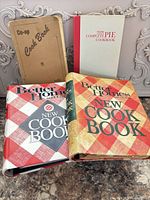 Group shot of the four cookbooks showing covers
