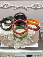 Group of bracelets arranged together showing variety of colors and styles