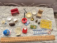 Overview of all miniature pieces with ruler for scale