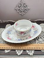 Tray and dish top view showing floral design, ruler for scale