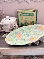 Platter, warmer and decorator box grouped together