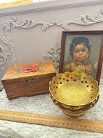 Overall lot showing jewelry box, stacked brass bowls, framed portrait with ruler for scale