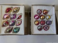Open boxes showing 20 glass ornaments in trays